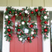 Red and White christmas wreath hanging on door Thumbnail | Christmas World