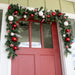 Nordic red and white Christmas Garland displayed on door Thumbnail | Christmas World
