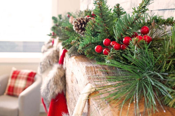 Christmas garland draped over a mantel  | Christmas World